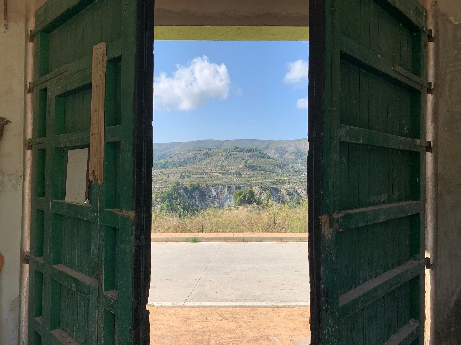 Green door with a view on the mountain behind property purchase support javea